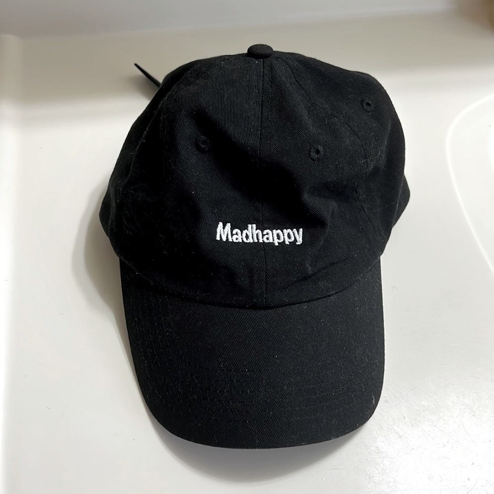 Madhappy black baseball cap. Says Madhappy in white. Never warn.